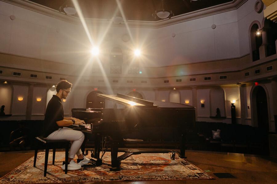 a student from the major in instrument performance playing the piano